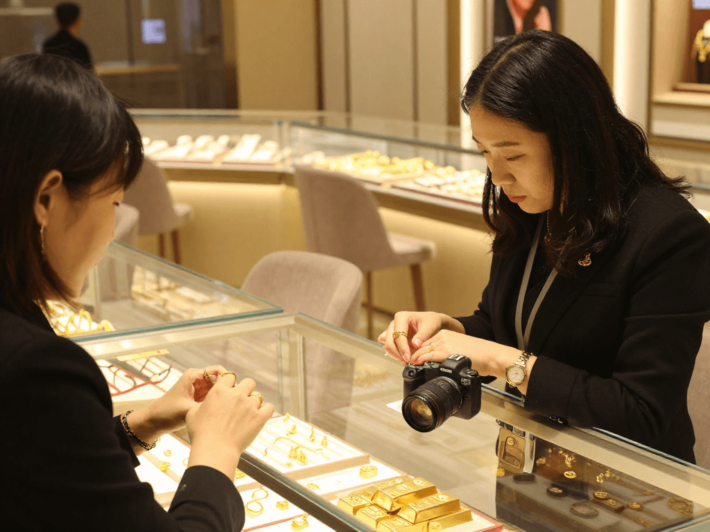 Mantra88 jewelry showcasing 24K gold pieces in an elegant store atmosphere